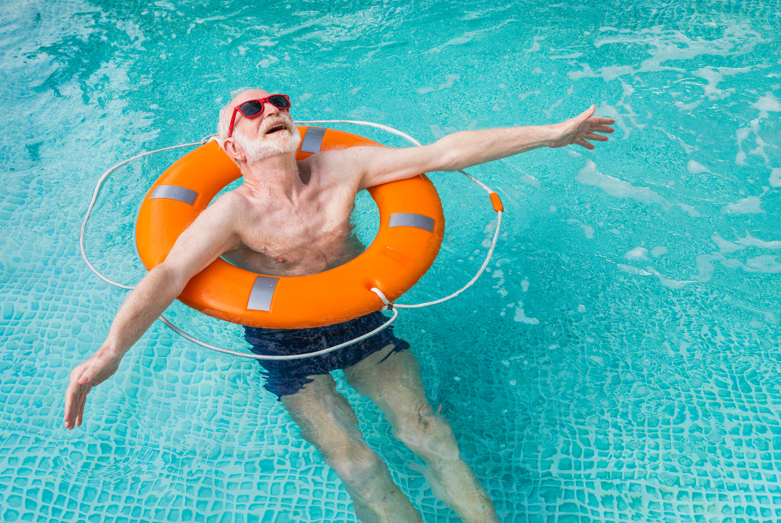 Happy Senior Man at the Swimming Pool